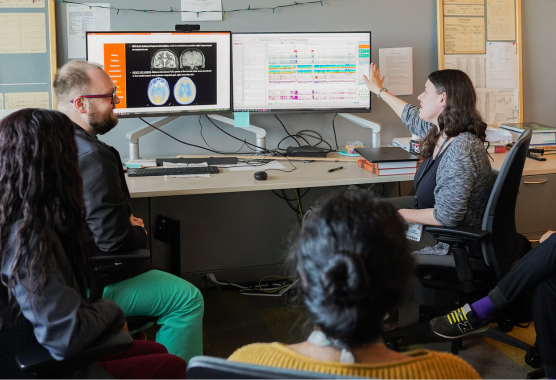 Epilepsy fellow working with faculty