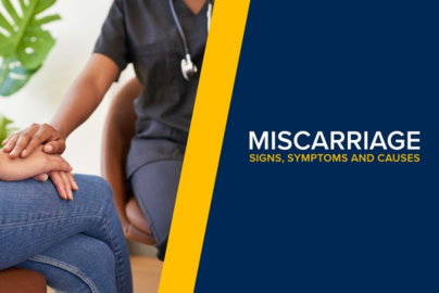 A healthcare worker holds a patient's hands next to the text "understanding miscarriage."