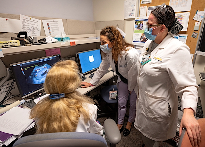 doctors talking and examining medical records