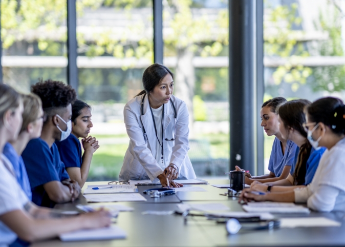 doctors and med students meeting at a conference table
