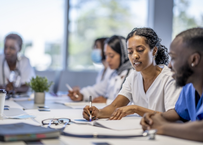 med students looking at forms