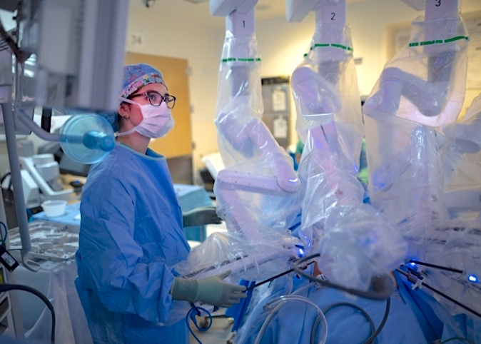 doctor performing robotic surgery