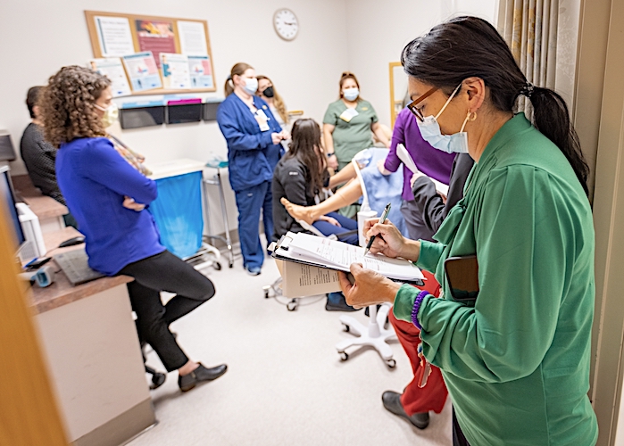 fellows training in patient exam room