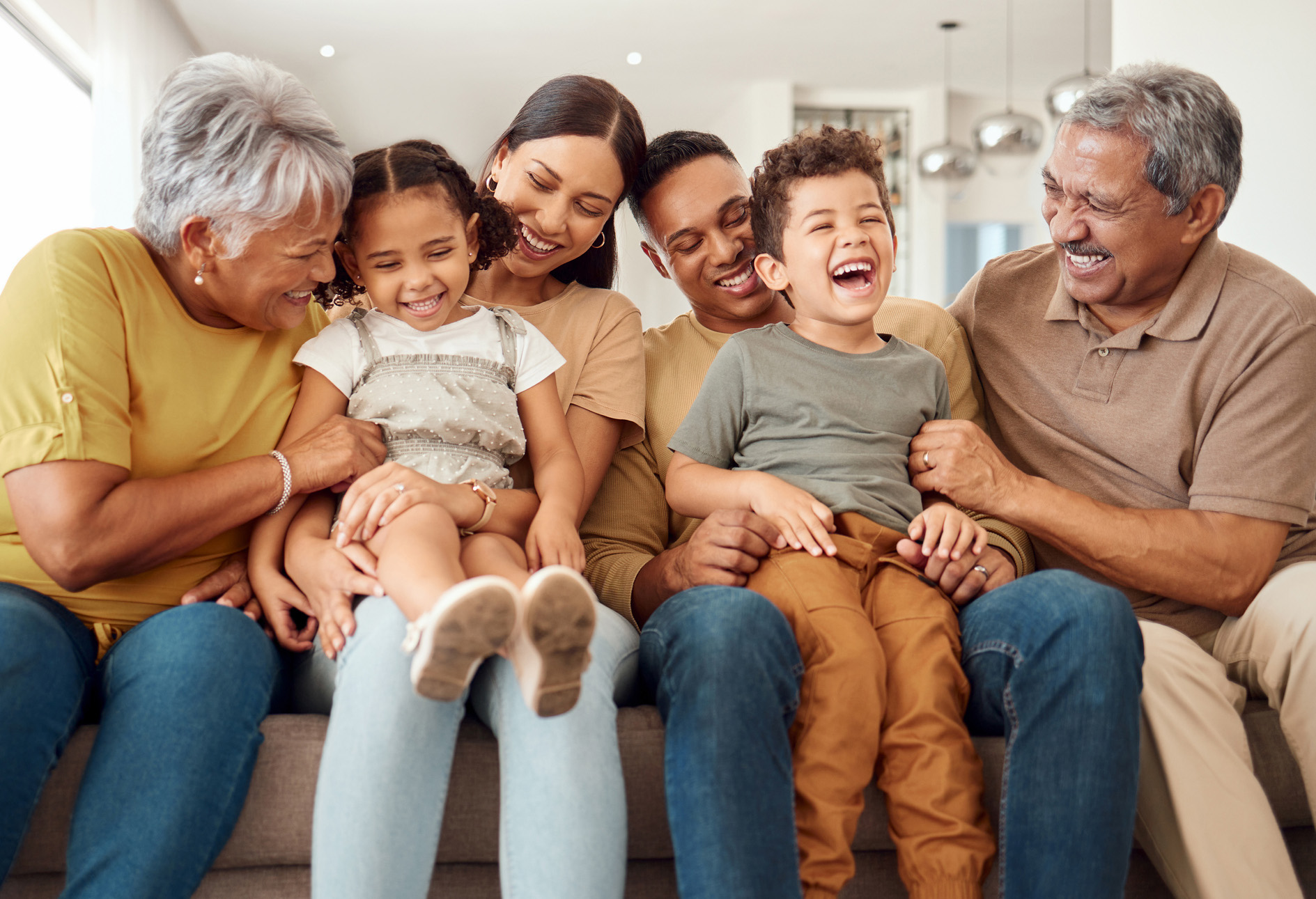 Multigenerational family smiling and laughing