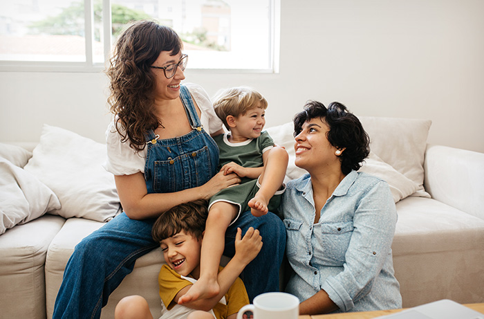 Happy LGBTQ+ family at home