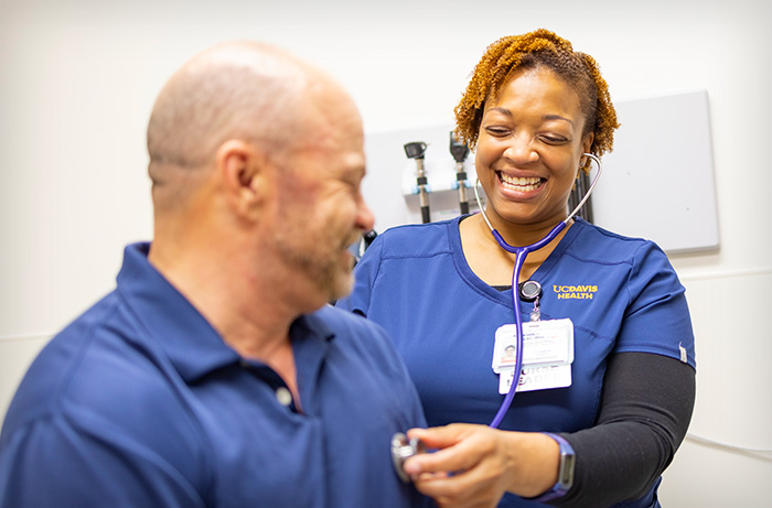 Adult receiving check-up with UC Davis primary care provider