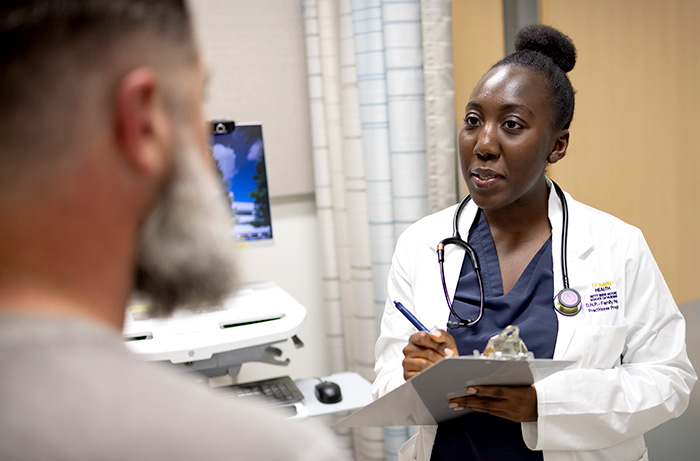 Adult male patient receiving check-up in clinic