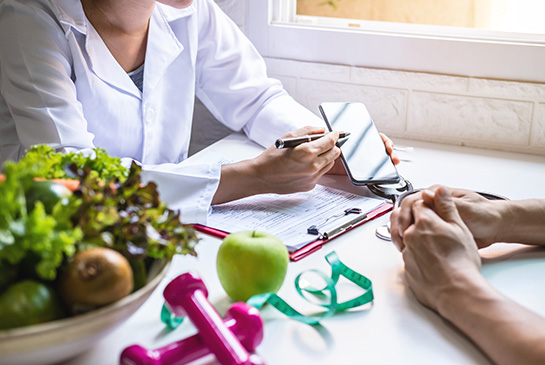 Health care professional counseling a patient