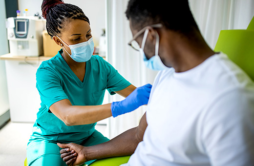Nurse drawing blood from patient