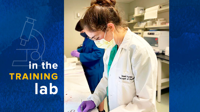 Neonatal fellow working in a lab.