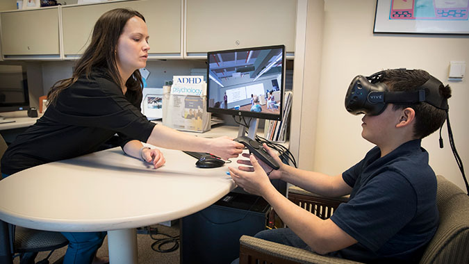 MIND Institute faculty member with patient