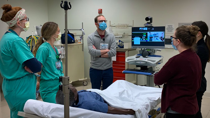group photo of neonatal-perinatal fellows in a medical office setting