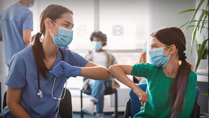 provider and patient elbow bump, stock image