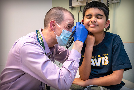 Dr. Crossen providing well-care visit for pediatric patient