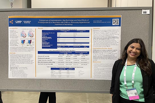 Resident and mentor doctor present QIPS poster and study.