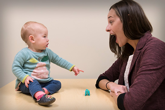 Faculty member with young infant at the MIND Institute