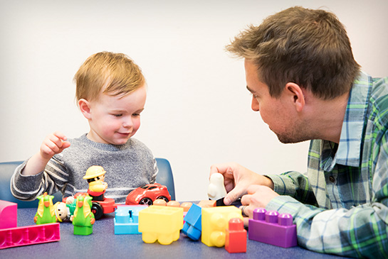 CAARE provider playing with young boy