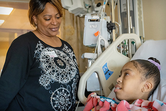 Kidney dialysis patient with Mom in clinic room