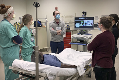 UC Davis resident providing training in pediatric critical care treatment room