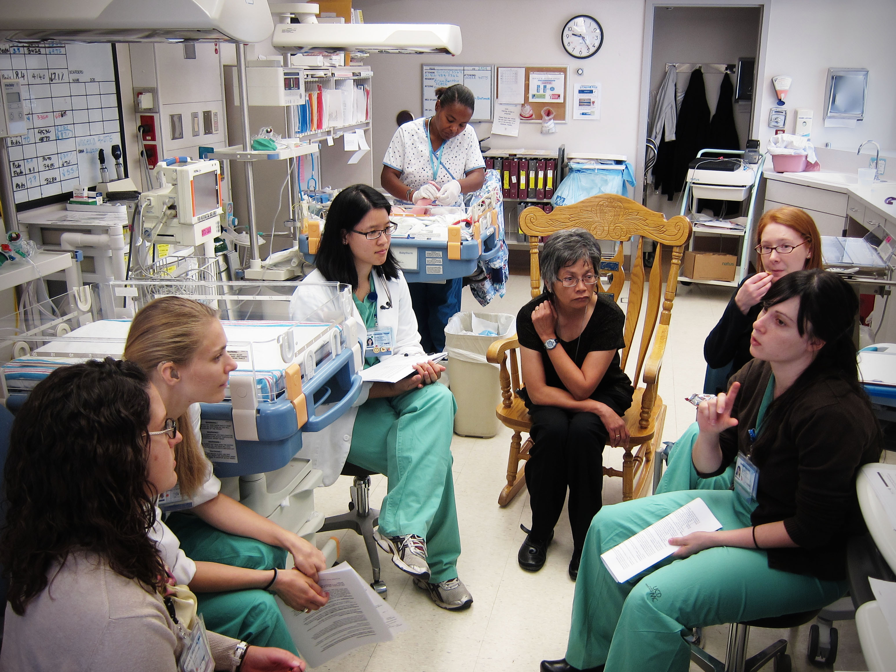 Doctors meet in hospital NICU.