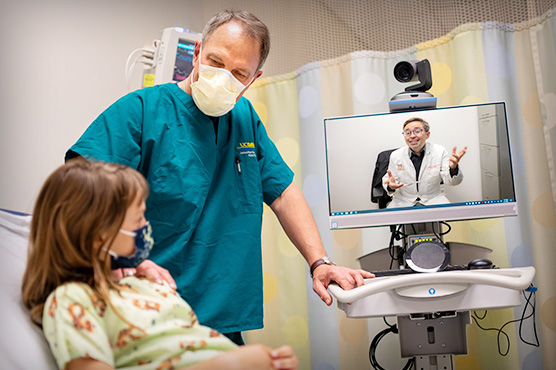 Dr. James Marcin with patient, telehealth consult