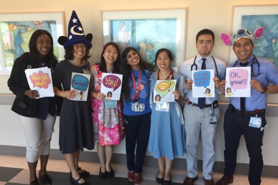 Residents pose for photo while dressed up for Halloween.