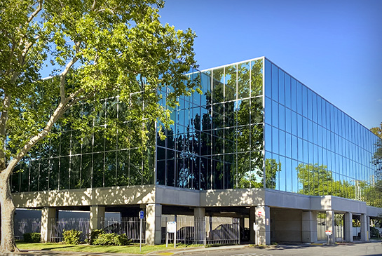 Ticon II Building, 3 story building with all glass tinted windows.