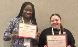 UPHS students holding certificates