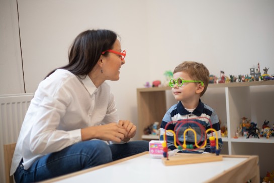 A woman playing with a child