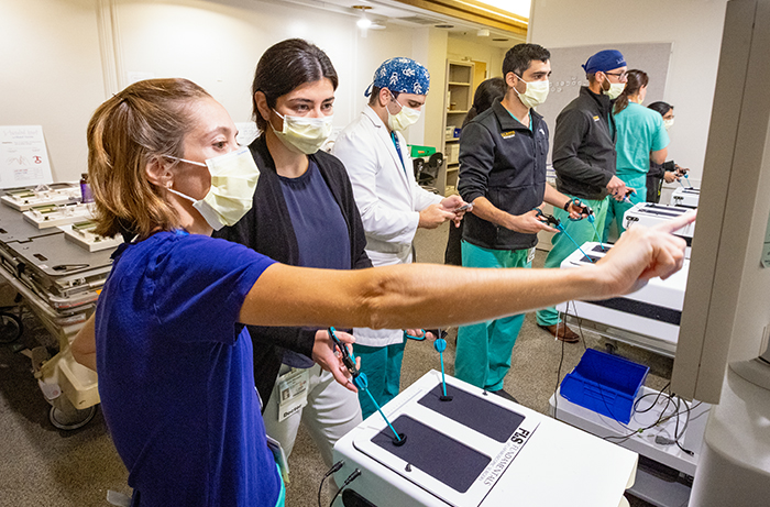 Two UC Davis Health residents working in the hospital