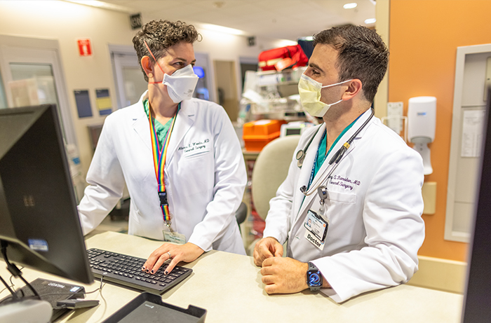 Two UC Davis Health residents working in the hospital