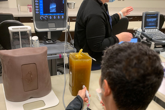Researchers working on an experimental spine.