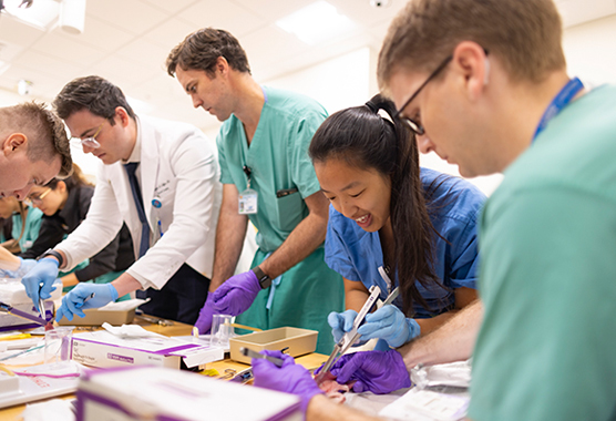 Surgery residents in surgical skills training at CHT simulation suites.
