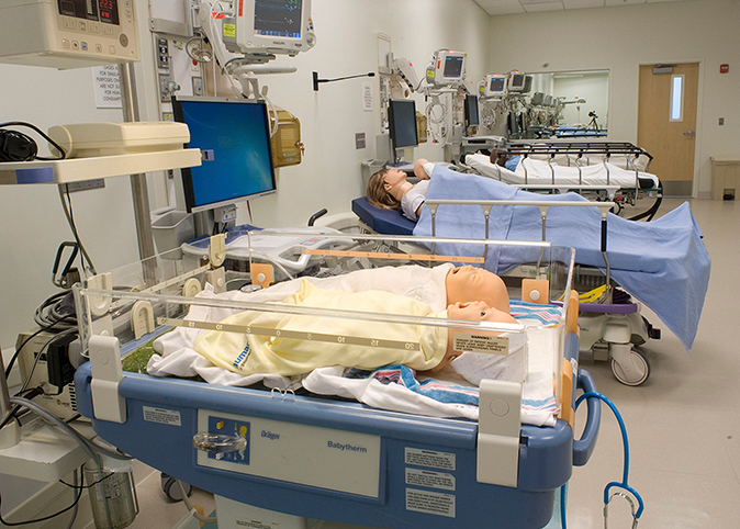 A room filled with equipment and simulation mannequins.