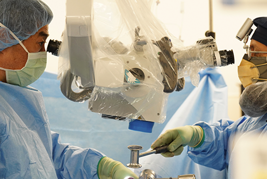 Neurological surgeons performing a spine surgery