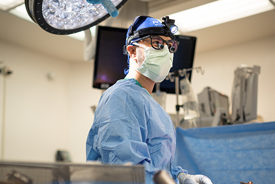 spine surgeon in an operating room