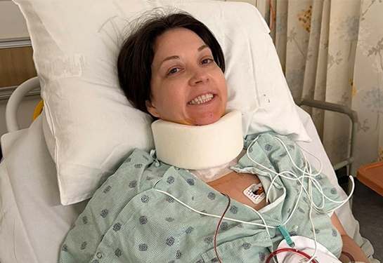 patient with neck brace smiling