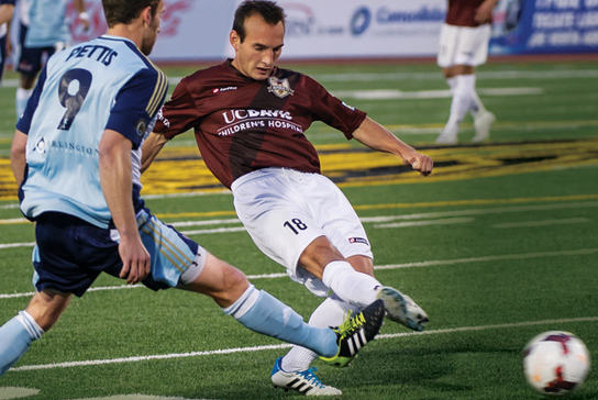 Five Sacramento Republic FC soccer players walking across the field. 