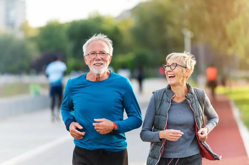 Fit older couple jogging