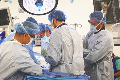 Orthopaedic surgeons working.