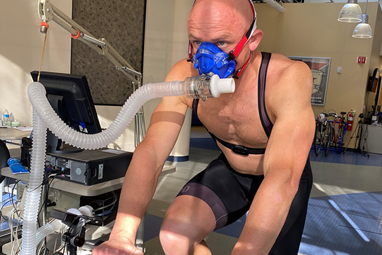A man on a cycling lung test machine