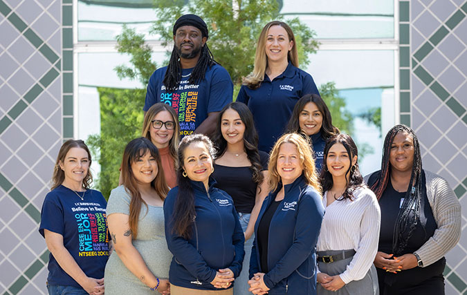 Eleven members of the Trauma Recovery Center Team post outside center building