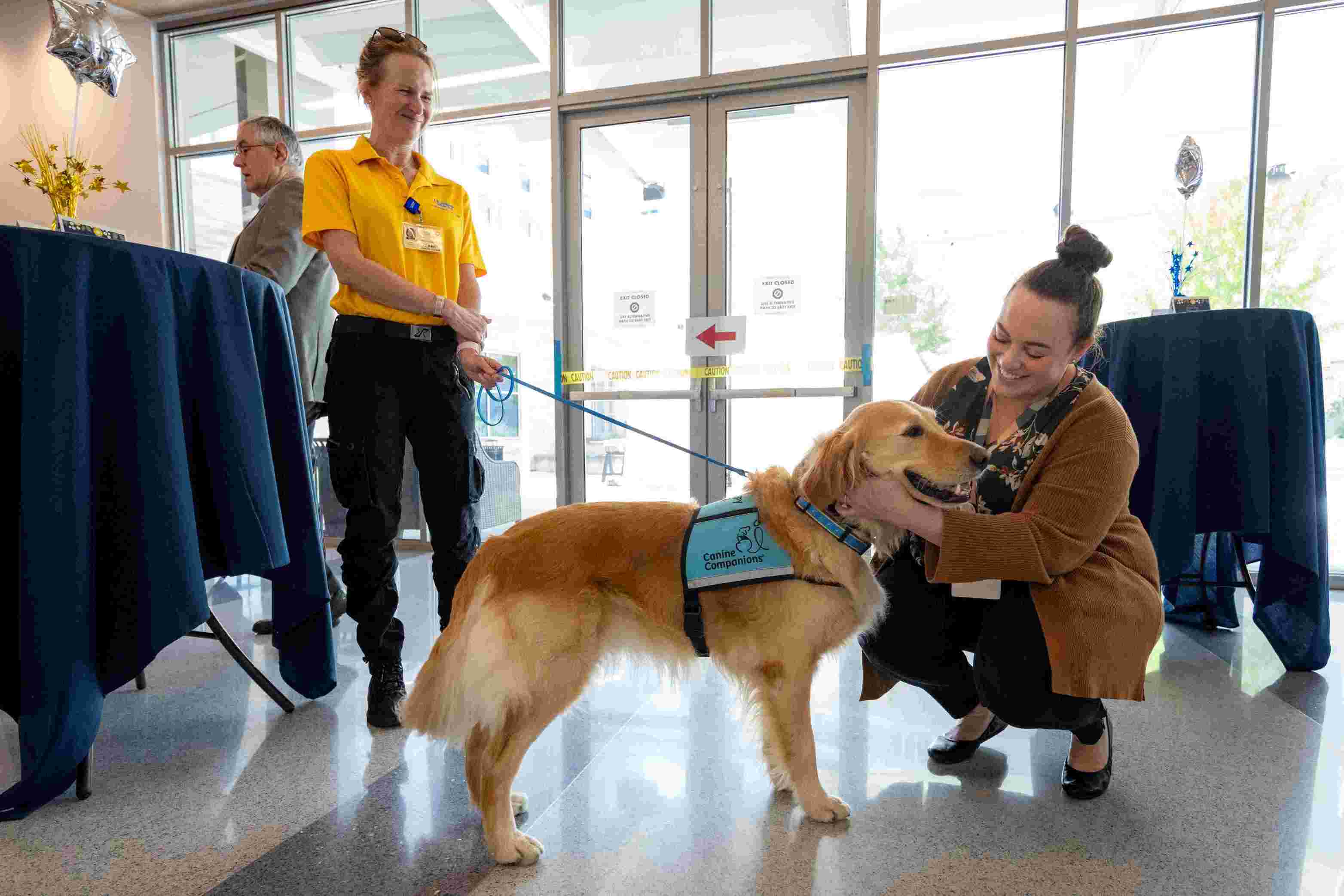 K9 volunteer greeting a patient.