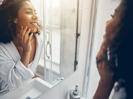 Woman putting on makeup