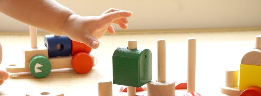 kid hand with blocks