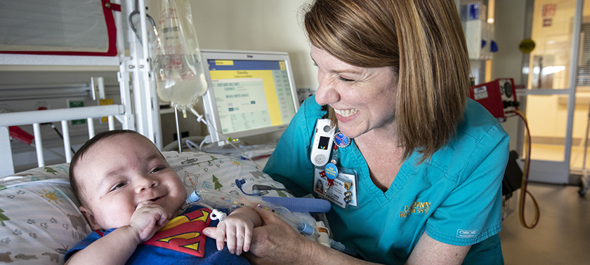 NICU nurse with baby