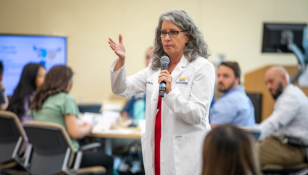 Teresa Thetford in a classroom with students