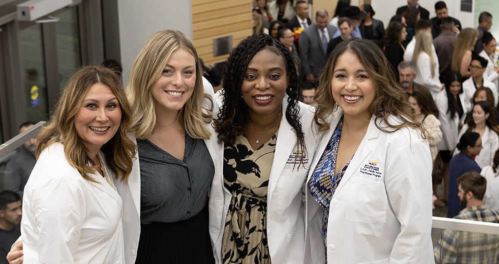 Members of the DNP-FNP Class of 2025 celebrate their White Coat ceremony in November 2023.