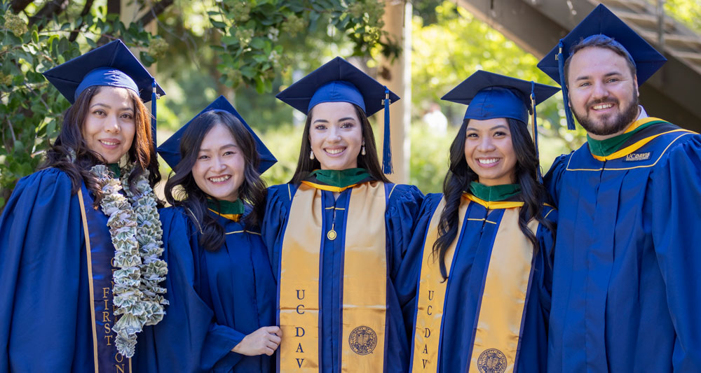 Students gather outside of the Mondavi Center for a photo opportunity following their commencement ceremony in 2024.
