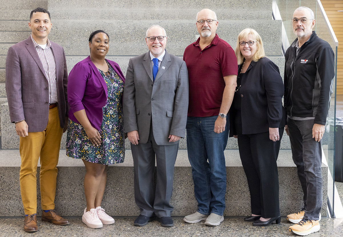 The 2023-2024 National Advisory Council with Dean Stephen Cavanagh, center.